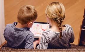 children watching a screen