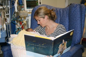 mum reading to premature baby