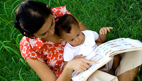 mum reading to baby