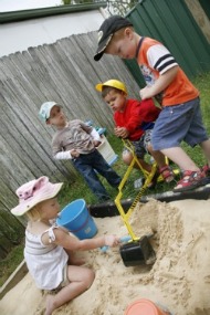 children playing in sandpit