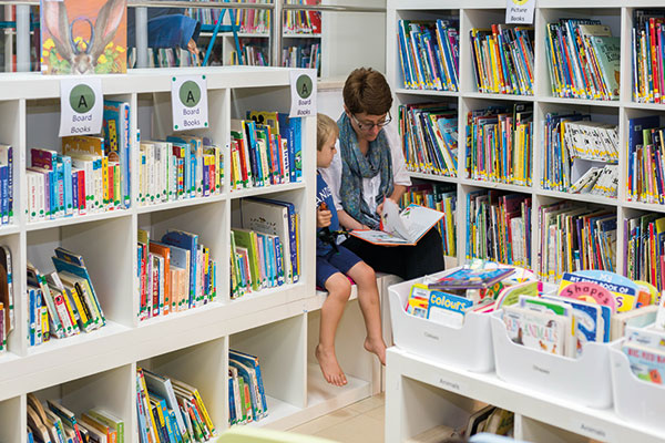 mum and son in library,