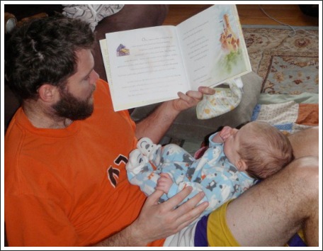 dad reading to baby