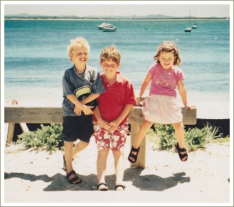 three children at the beach