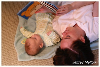 mum reading to baby